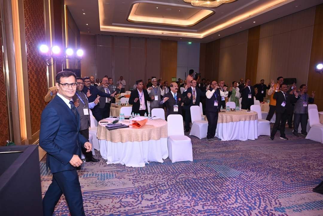 Corporate leadership team celebrating at a conference