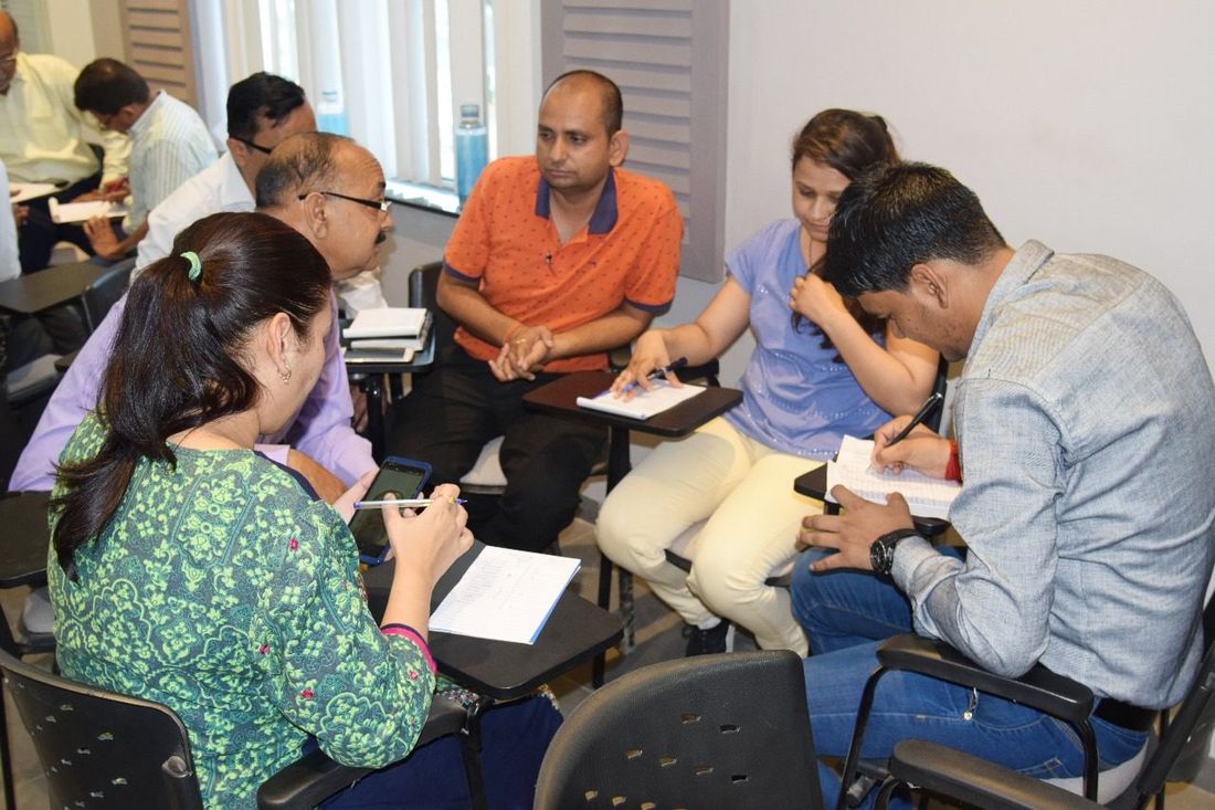 Small group coaching session for emerging leaders