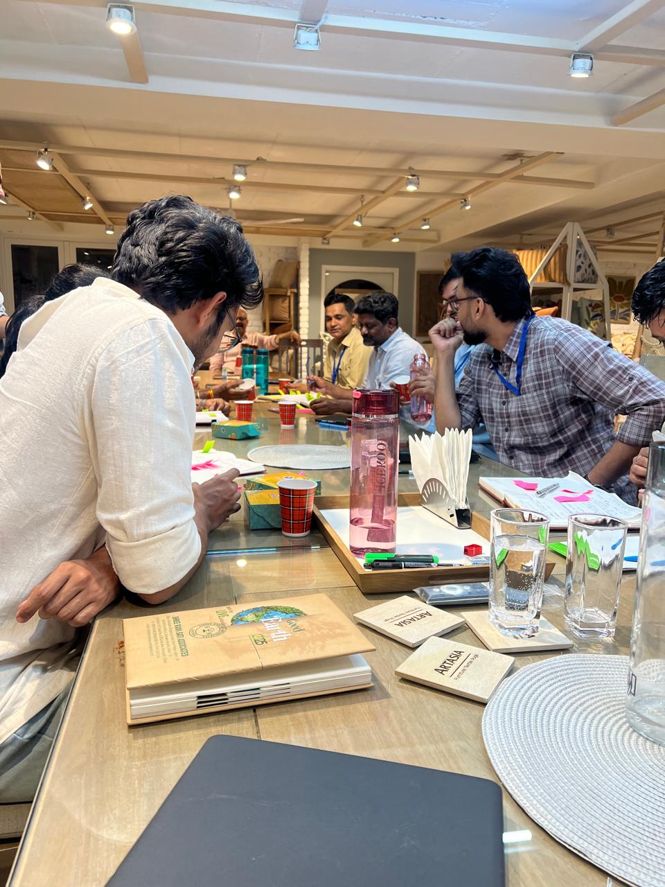Team working through a commitment canvas during an offsite
